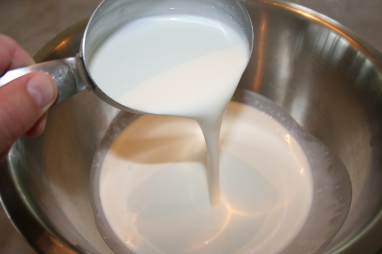 Pour Cream In Metal Bowl