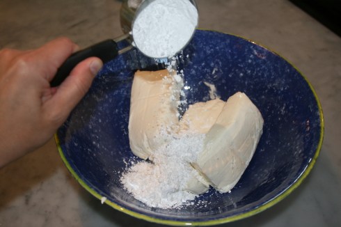 Add powdered sugar to cream cheese