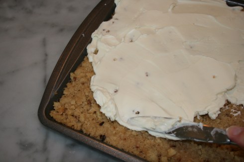 Spread cream cheese on cookie crust